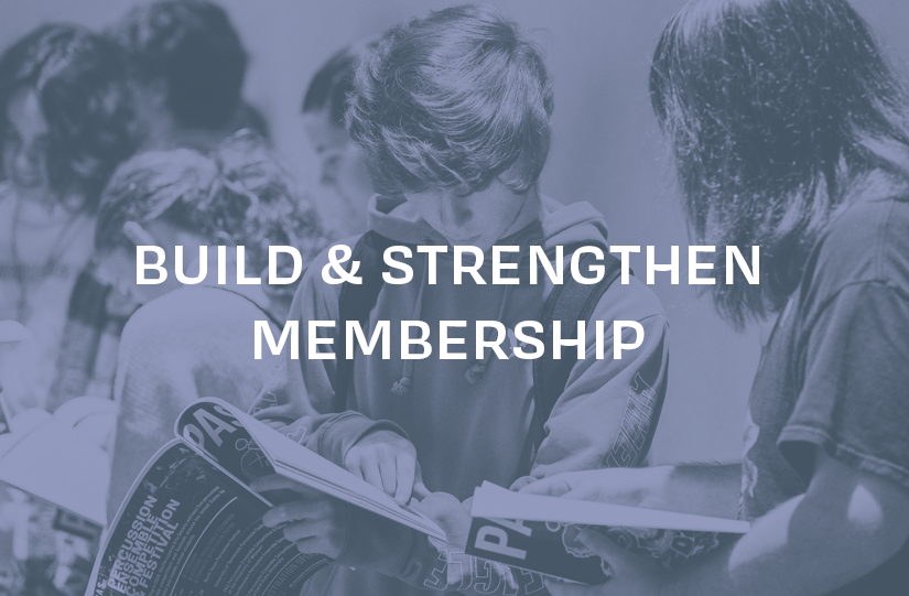 The words "build and strengthen membership" over an image of PAS members reading a program